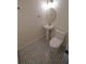 Stylish bathroom with pedestal sink, toilet, and patterned floor tiles at 414 S Shore Crest Dr, Tampa, FL 33609