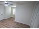 Spacious bedroom featuring wood-look floors and a ceiling fan at 414 S Shore Crest Dr, Tampa, FL 33609