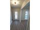 Light and airy entryway with wood-look floors and a glass door at 414 S Shore Crest Dr, Tampa, FL 33609