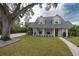 Two-story house with gray roof, white siding, and landscaped yard at 414 S Shore Crest Dr, Tampa, FL 33609