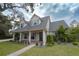 Two-story house with gray roof, white siding, and landscaped yard at 414 S Shore Crest Dr, Tampa, FL 33609