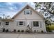 House exterior showcasing white brick, new windows, and landscaping at 414 S Shore Crest Dr, Tampa, FL 33609