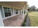 Brick-paved porch with white columns and gray door at 414 S Shore Crest Dr, Tampa, FL 33609