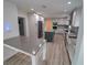 Modern kitchen with gray countertops, white cabinets, and a large island at 414 S Shore Crest Dr, Tampa, FL 33609