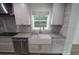 Modern kitchen with farmhouse sink and gray countertops at 414 S Shore Crest Dr, Tampa, FL 33609