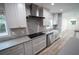 Modern kitchen with gray countertops and stainless steel appliances at 414 S Shore Crest Dr, Tampa, FL 33609