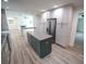 Open concept kitchen with island and stainless steel appliances at 414 S Shore Crest Dr, Tampa, FL 33609