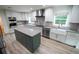 Renovated kitchen with stainless steel appliances and a farmhouse sink at 414 S Shore Crest Dr, Tampa, FL 33609