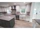 Modern kitchen with stainless steel appliances and a farmhouse sink at 414 S Shore Crest Dr, Tampa, FL 33609