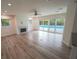Spacious living room with fireplace and sliding glass doors leading to the pool at 414 S Shore Crest Dr, Tampa, FL 33609