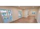 Bright and airy living room with hardwood floors and plantation shutters at 414 S Shore Crest Dr, Tampa, FL 33609