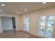 Open living room with wood flooring and plantation shutters at 414 S Shore Crest Dr, Tampa, FL 33609