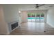 Bright living room with hardwood floors, fireplace and pool view at 414 S Shore Crest Dr, Tampa, FL 33609