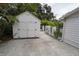 White storage shed with double doors in backyard at 414 S Shore Crest Dr, Tampa, FL 33609