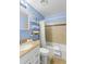 Updated bathroom with tub, shower, and light blue walls at 4215 E Bay Dr # 1105C, Clearwater, FL 33764