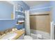Clean bathroom with tub, shower, and granite countertop at 4215 E Bay Dr # 1105C, Clearwater, FL 33764