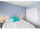 Spacious bedroom with a cozy bed and soothing blue walls at 4215 E Bay Dr # 1105C, Clearwater, FL 33764