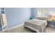 Bedroom with a queen bed, light walls, and beachy decor at 4215 E Bay Dr # 1105C, Clearwater, FL 33764