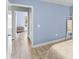 Hallway with light wood flooring and access to other rooms at 4215 E Bay Dr # 1105C, Clearwater, FL 33764