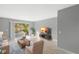 Living room showcases stylish furnishings, wood-look floors, and balcony access at 4215 E Bay Dr # 1105C, Clearwater, FL 33764