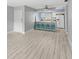 Living area features wood-look floors and an open floor plan at 4215 E Bay Dr # 1105C, Clearwater, FL 33764