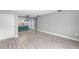 Bright living room with wood-look floors and open concept to kitchen at 4215 E Bay Dr # 1105C, Clearwater, FL 33764