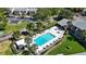 Community pool with surrounding lounge chairs and patio area at 4215 E Bay Dr # 1105C, Clearwater, FL 33764