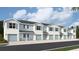 Row of beautiful townhomes, each featuring a garage and matching exterior paint scheme at 4644 Pleasant Ave, Palm Harbor, FL 34683