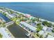 Aerial view of waterfront property with boat slips and community pool at 5005 Coquina Key Se Dr # B, St Petersburg, FL 33705