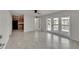 Bright living room with tile floors and access to patio at 5005 Coquina Key Se Dr # B, St Petersburg, FL 33705