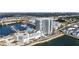 Aerial view of building, parking garage and private boat dock at 5120 Marina Way # 2208, Tampa, FL 33611
