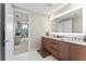 Bathroom with a double vanity and a view into another bedroom at 5120 Marina Way # 2208, Tampa, FL 33611