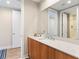 Modern bathroom with wood vanity, vessel sink, and a large mirror at 5120 Marina Way # 2208, Tampa, FL 33611
