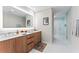 Modern bathroom with a double vanity and frameless shower at 5120 Marina Way # 2208, Tampa, FL 33611