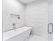 Spa-like bathroom with a freestanding soaking tub and walk-in shower at 5120 Marina Way # 2208, Tampa, FL 33611