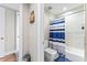 Simple bathroom with shower/tub combo, toilet and striped shower curtain at 5120 Marina Way # 2208, Tampa, FL 33611