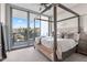Main bedroom with a canopy bed and stunning water views at 5120 Marina Way # 2208, Tampa, FL 33611
