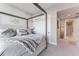 Main bedroom with a canopy bed and ensuite bathroom access at 5120 Marina Way # 2208, Tampa, FL 33611
