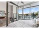Main bedroom with large windows, city views and a balcony at 5120 Marina Way # 2208, Tampa, FL 33611