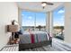 Bedroom with water views and a striped comforter at 5120 Marina Way # 2208, Tampa, FL 33611