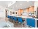 Modern kitchen with island and blue barstools at 5120 Marina Way # 2208, Tampa, FL 33611