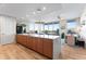Modern kitchen with island, hardwood floors, and water views at 5120 Marina Way # 2208, Tampa, FL 33611