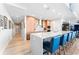 Modern kitchen with island seating, light wood cabinets, and stainless steel appliances at 5120 Marina Way # 2208, Tampa, FL 33611