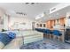 Modern kitchen features wood cabinetry and a breakfast bar with blue stools at 5120 Marina Way # 2208, Tampa, FL 33611