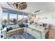 Spacious living room with large windows and comfortable sectional sofa at 5120 Marina Way # 2208, Tampa, FL 33611