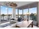 Living room with water views, comfortable seating, and a stylish wooden coffee table at 5120 Marina Way # 2208, Tampa, FL 33611