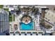 Top-down view of resort-style pool with surrounding lounge areas at 5120 Marina Way # 2208, Tampa, FL 33611
