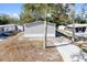 Single-Gathering home with driveway and mature trees at 5234 Yellow Pine N St, St Petersburg, FL 33709