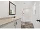 Clean bathroom with granite countertop and shower/tub combo at 5234 Yellow Pine N St, St Petersburg, FL 33709