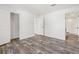 Spacious bedroom with wood-look floors and en-suite bathroom at 5234 Yellow Pine N St, St Petersburg, FL 33709